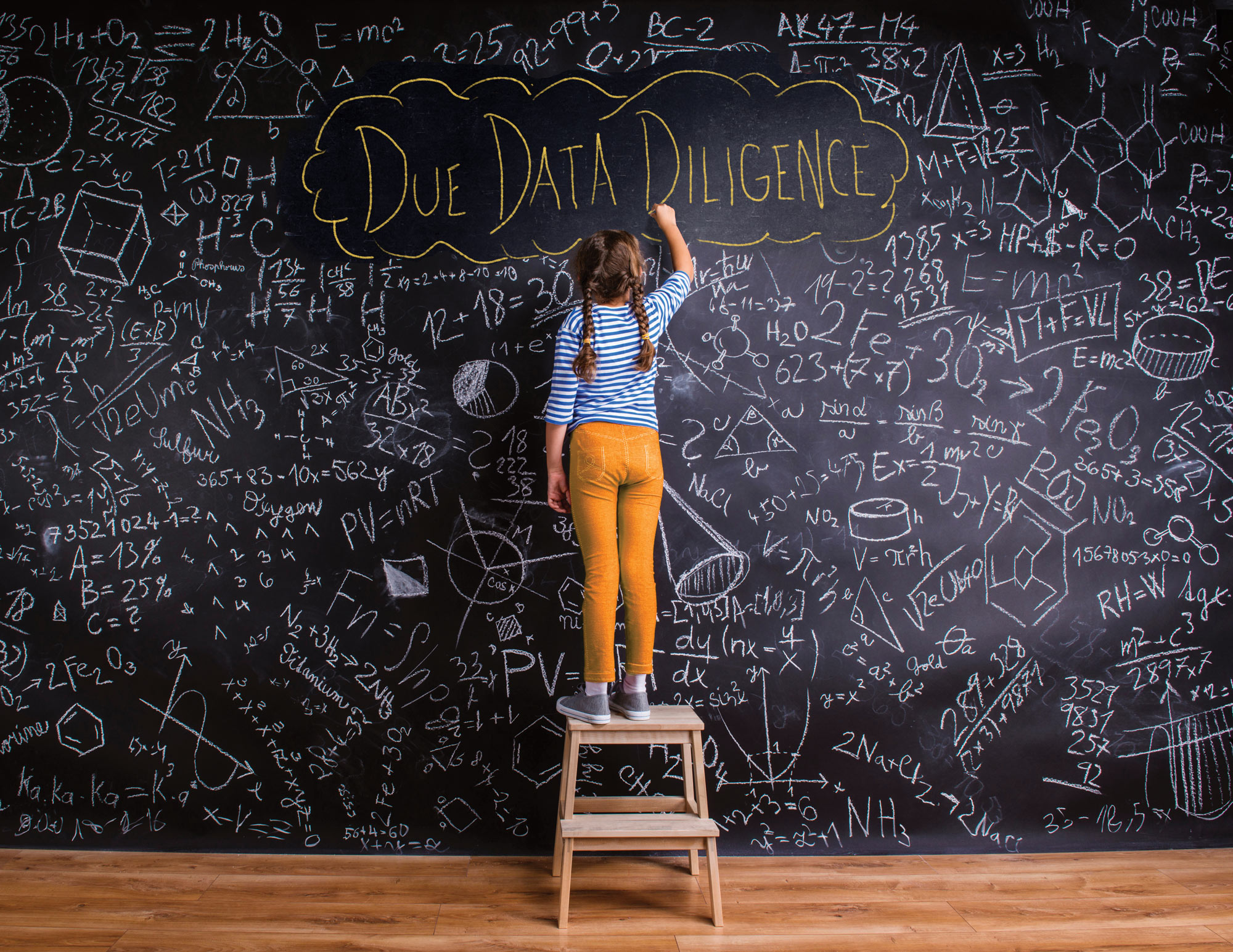 A student in front of a chalk board with lots of writing and the title Due Data Diligence