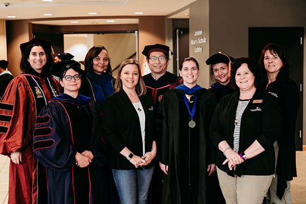 SISLT Faculty at Winter Graduate Reception 2019. Shown, from right: Dr. Sarah Buchanan, Dr. Denice Adkins, Dr. Joi Moore, Ms. Megan Wilkinson, Dr. Xinhao Xu, Dr. Danielle Oprean, Dr. Jenny Bossaller, Ms. Amy Adam, and Dr. Rose Marra